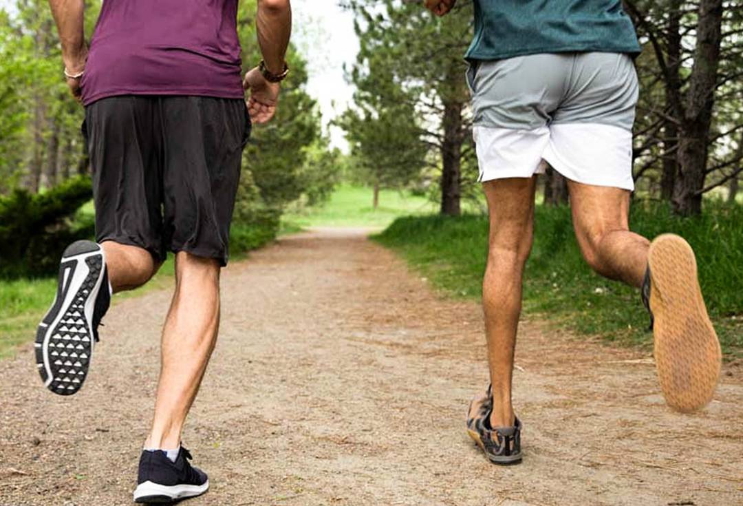 An image of two men on a trail run