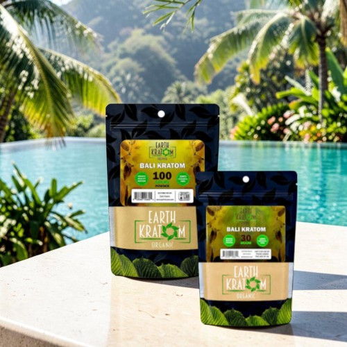 Two product packages near a pool surrounded by tropical plants.