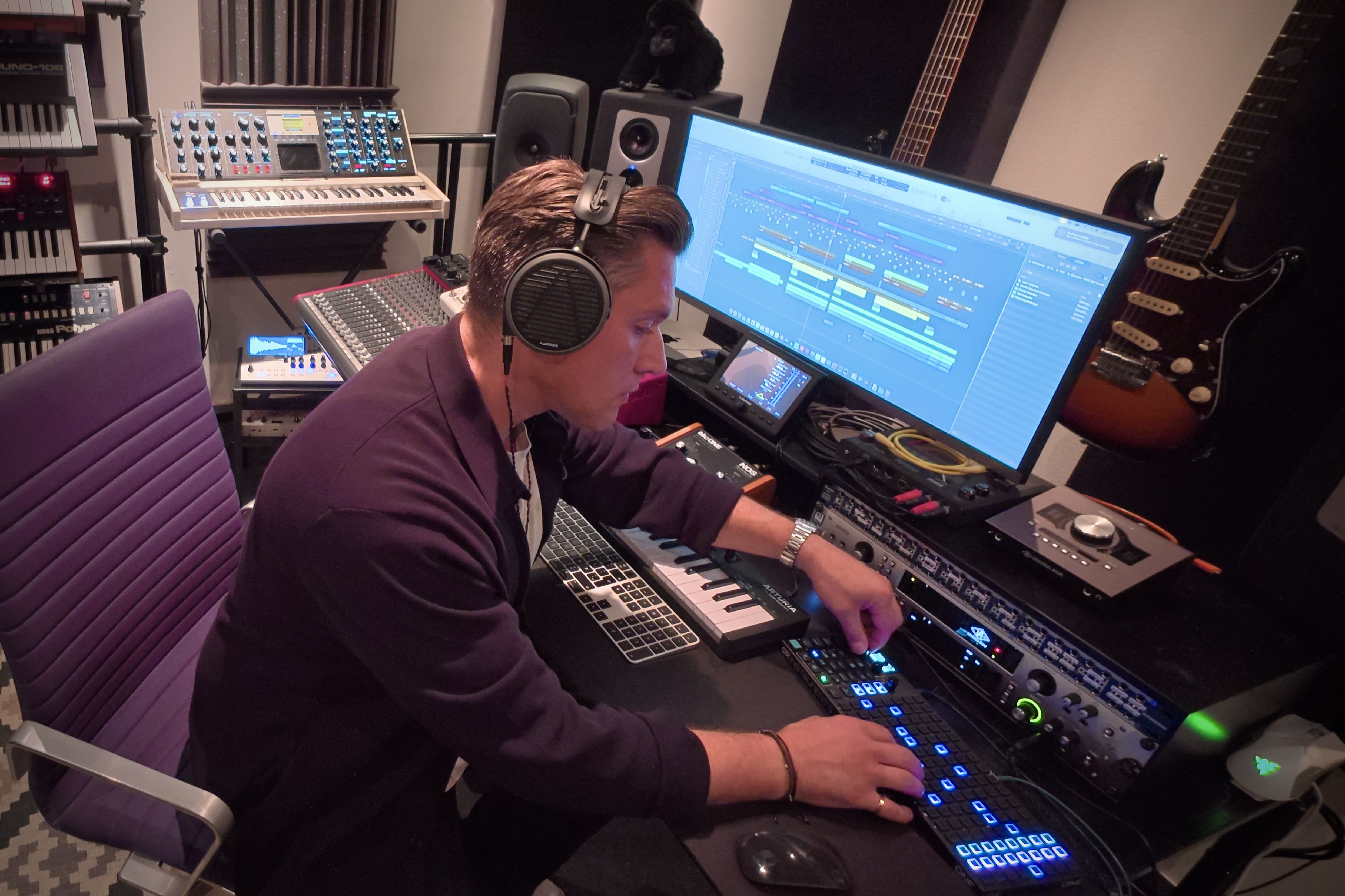 Denis Horvat wearing Audeze MM-500 headphones the studio