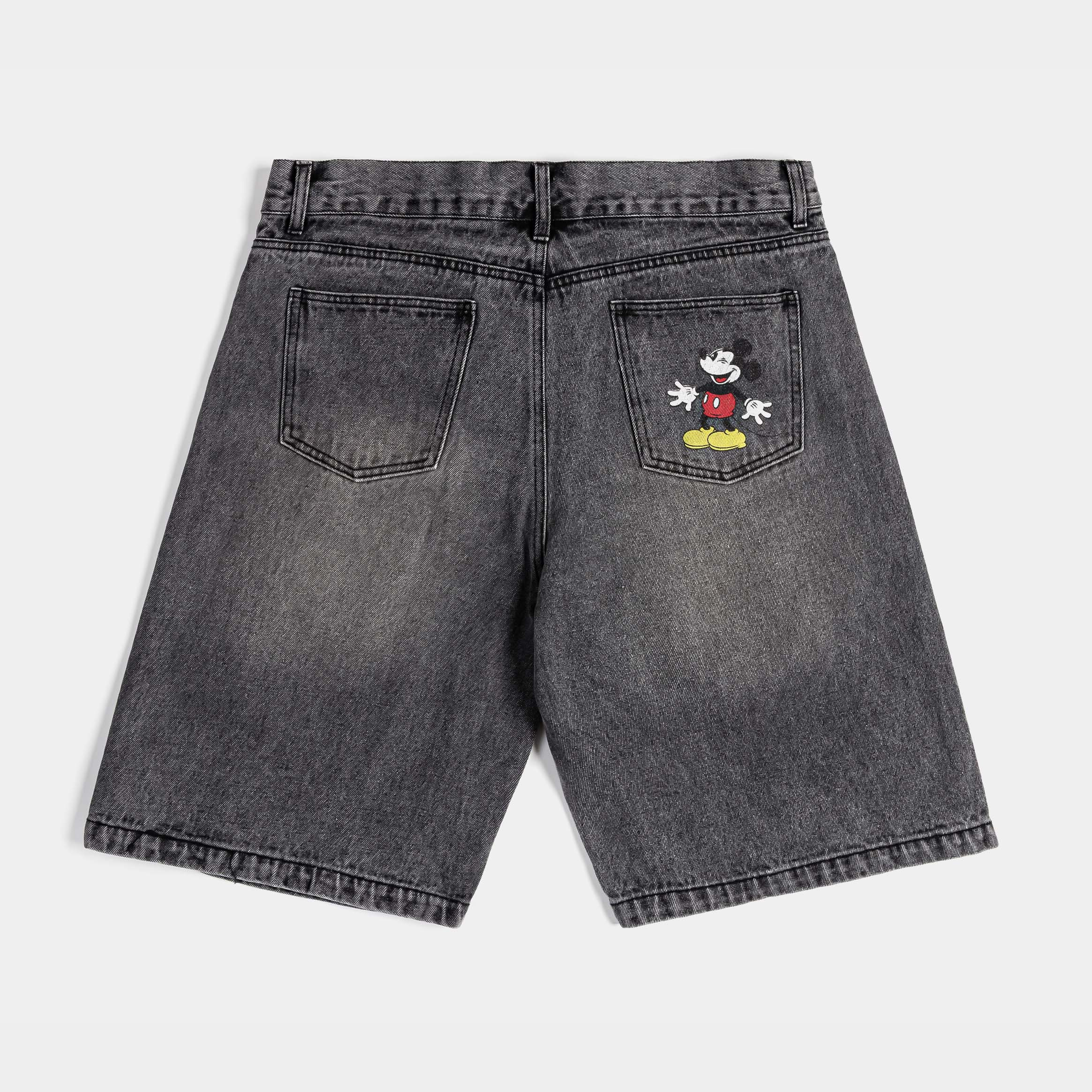 Gray denim shorts featuring Mickey Mouse graphics.