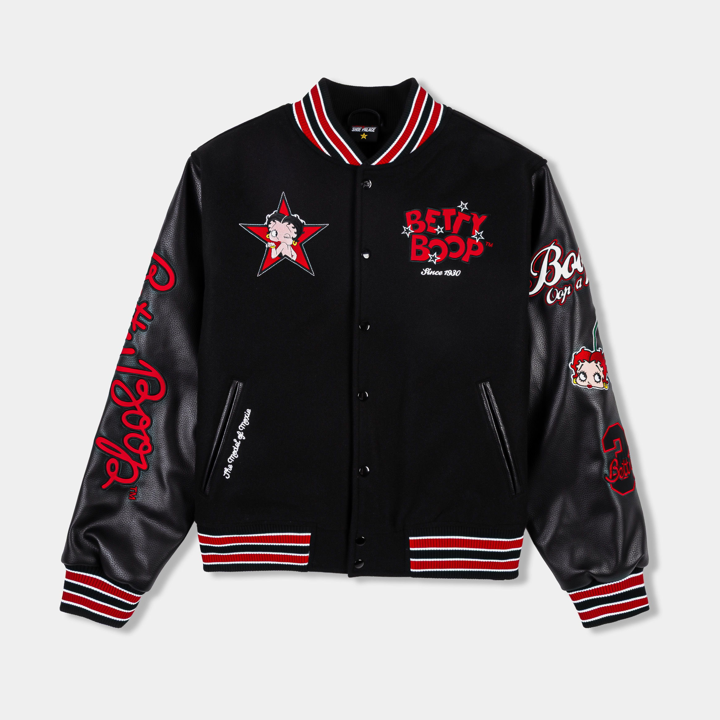 Black varsity jacket with red accents and graphic designs.