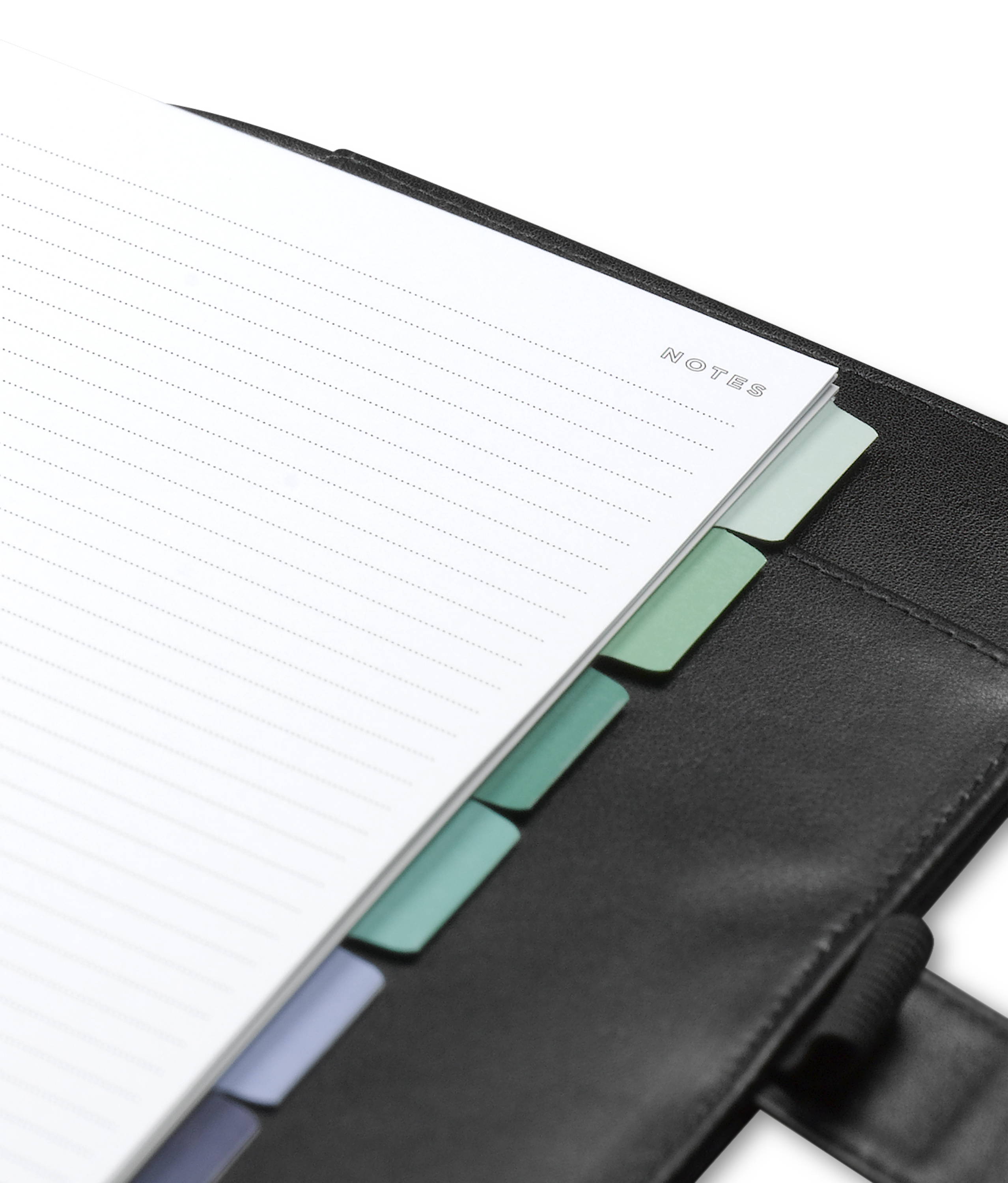 black a5 planner open to show liner, lined notes page and colorful blue tabs attached