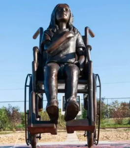 Bronze park statue of a girl in a wheelchair - Randolph Rose Collection