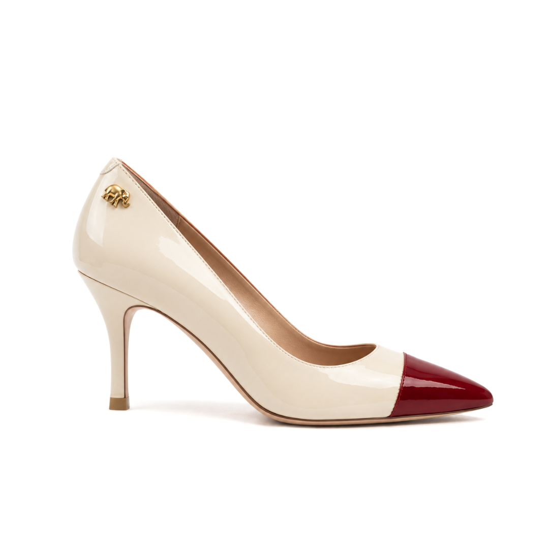 Beige and red high-heeled pump with a pointed toe.