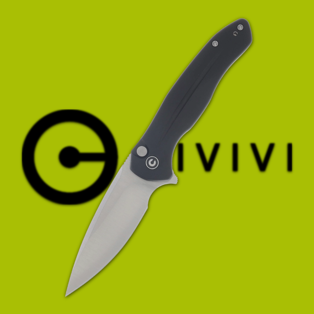 A folding knife with a black handle on a green background.