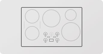 Cooktop with four burners and control knobs.