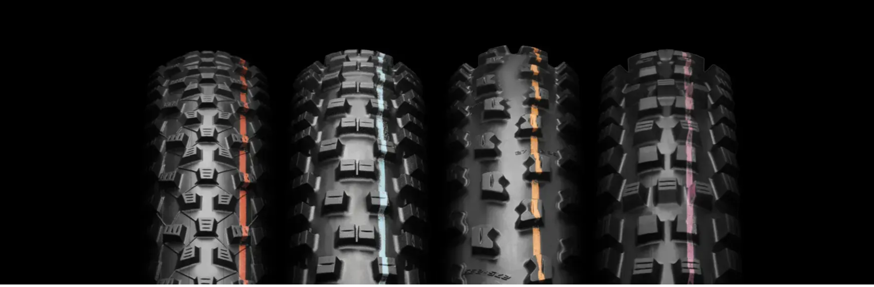various schwalbe mountain bike tires on a black background