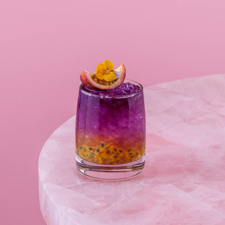 Ombre purple and yellow passion fruit cooler drink