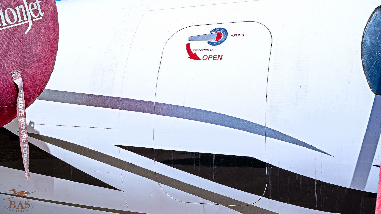 Airplane door with logo and design elements.
