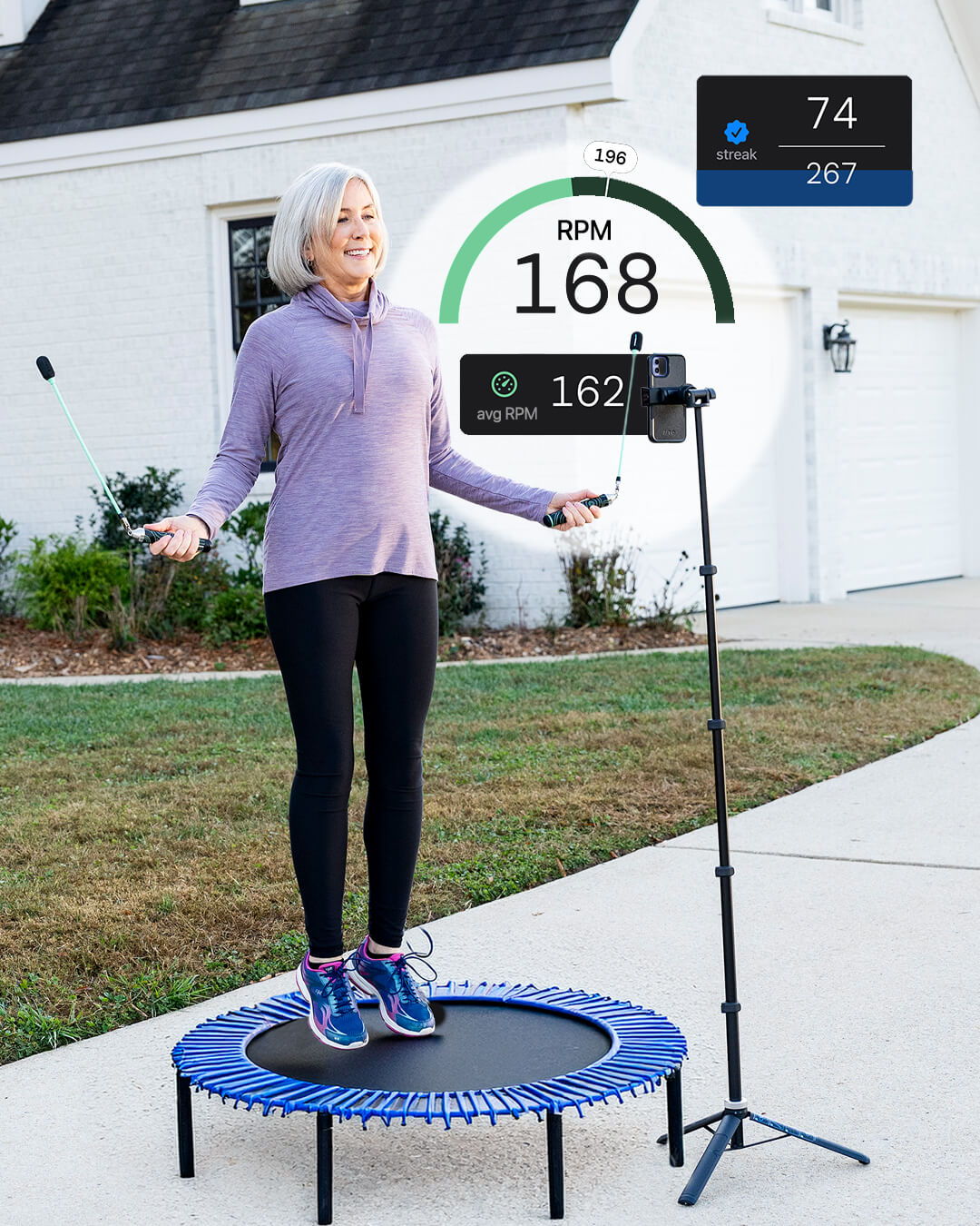 Elderly woman jumping on a rebounder with Crossrope Ropeless outdoors and app metrics overlaid