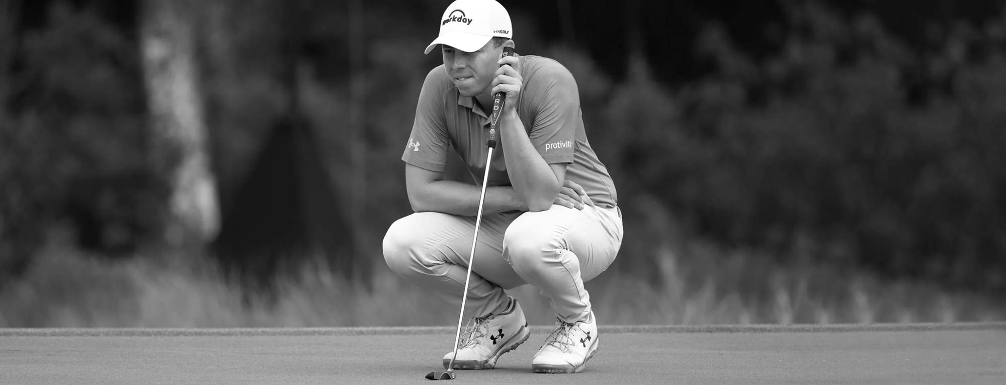 Matthew Fitzpatrick lining up putt