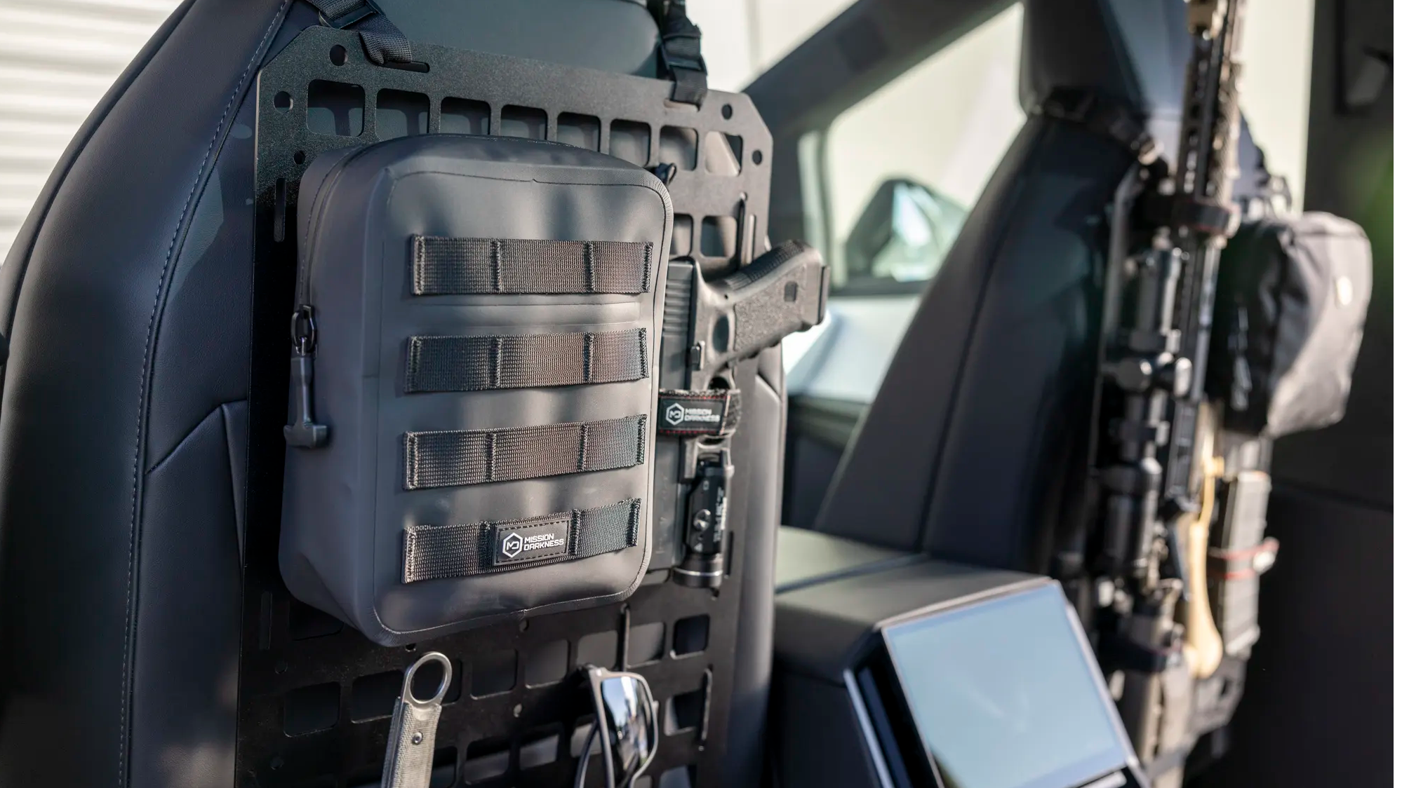 Mission Darkness Dry Shield MOLLE Faraday Pouch attached to molle panel in Tesla Cybertruck