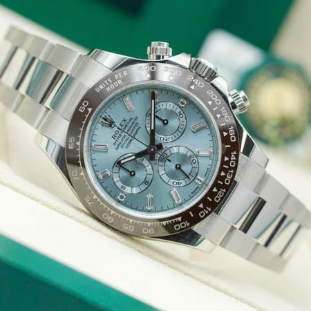 Silver and blue chronograph watch on a display.