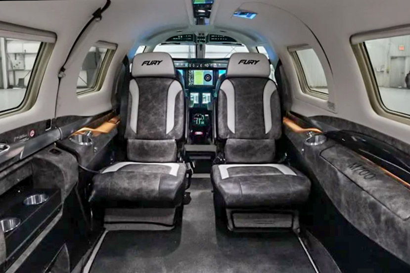 Interior of a luxury private jet with two pilot seats.