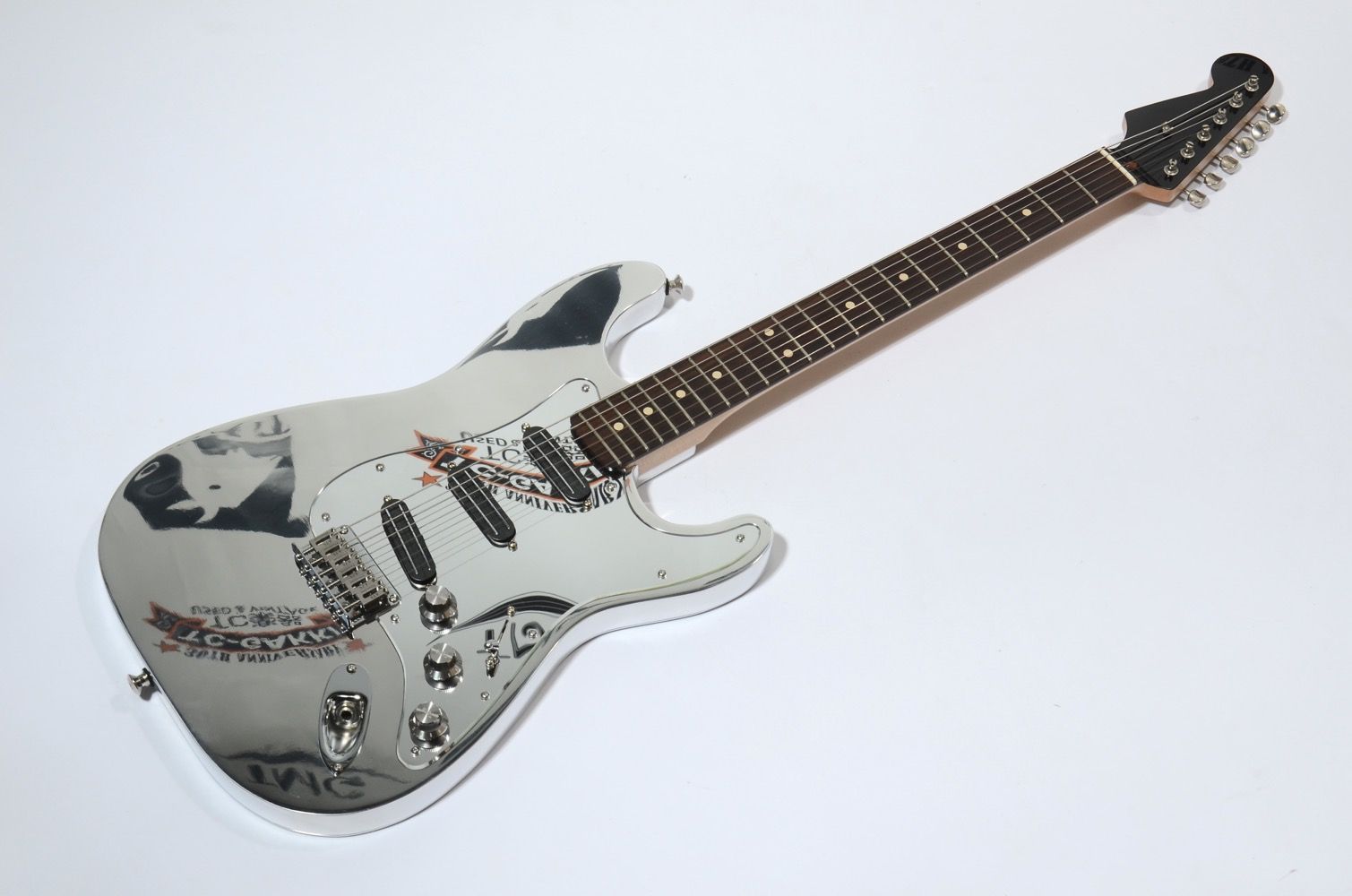 Electric guitar with a unique design and artistic graphics.