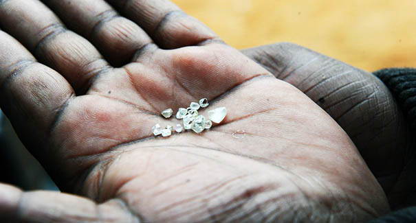 A hand holding blood diamonds