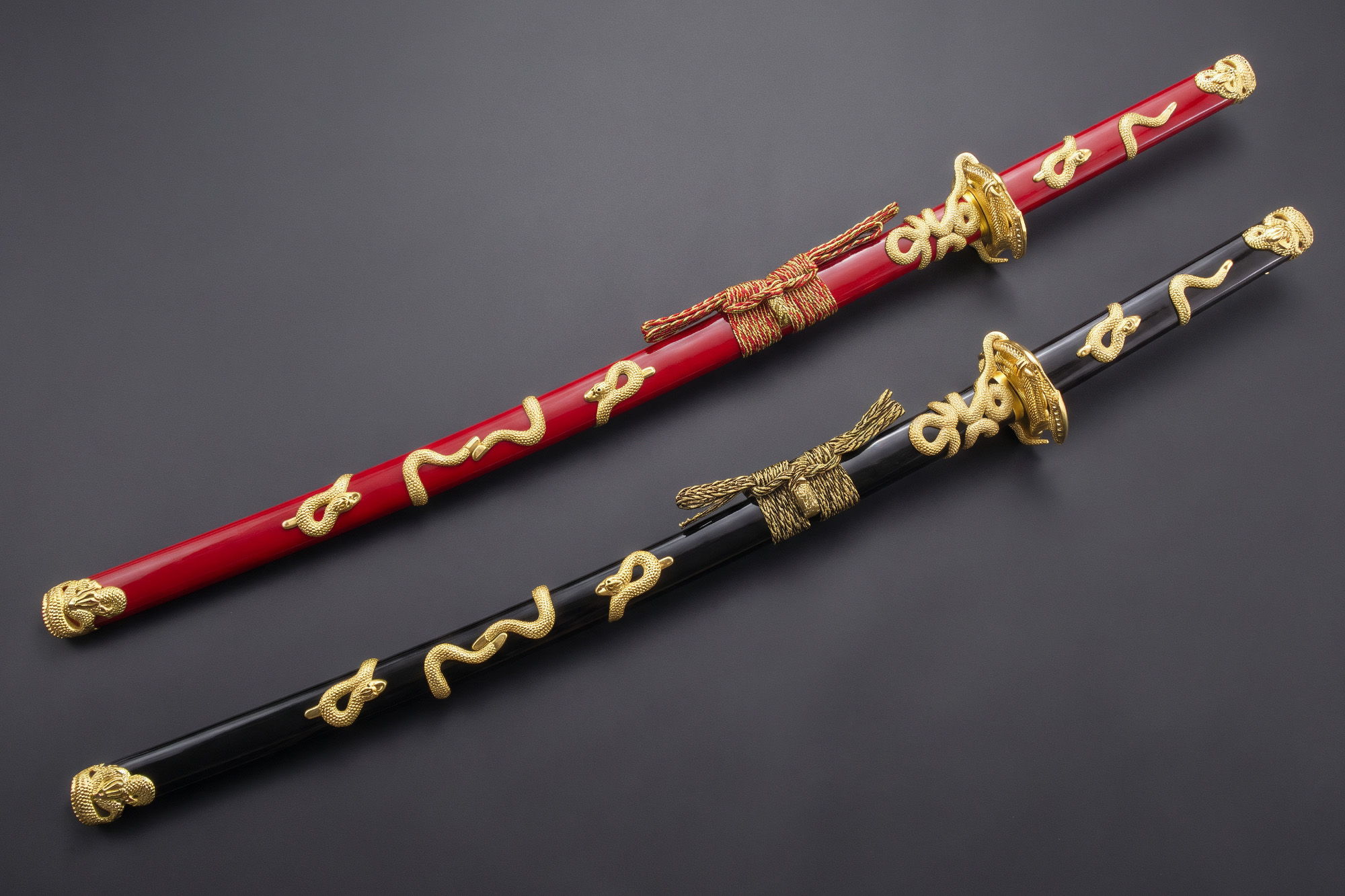 Two decorative swords with intricate designs on the handles.