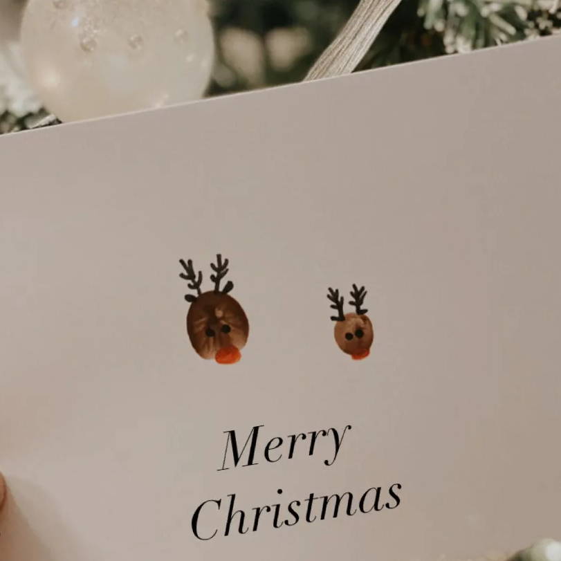 Claire's son's fingerprint used to make a reindeer for a Christmas card.