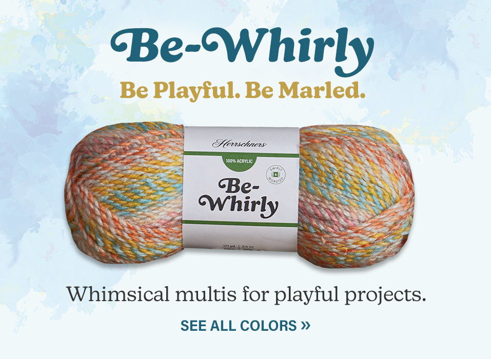 Skein of yarn with colorful, whimsical design and branding text. Be-Whirly. Be Playful. Be Marled. Whimsical multis for playful projects.