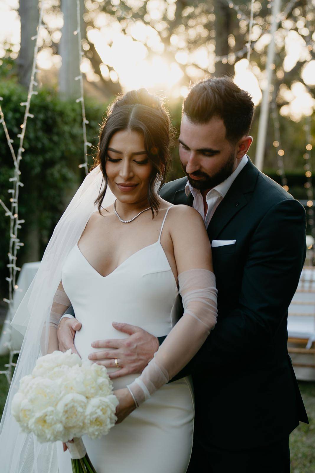 Groom holding Bride in his arms