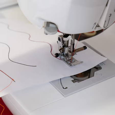 sew on curved lines on paper with a sewing machine