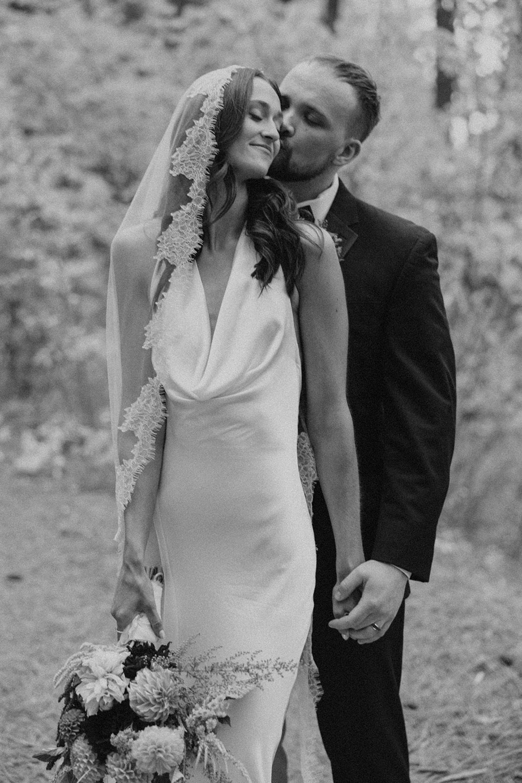 Bride and groom surrounded by nature