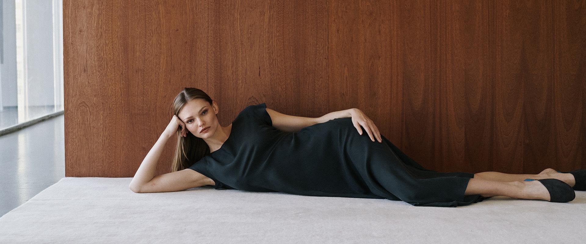 Woman laying down in dress