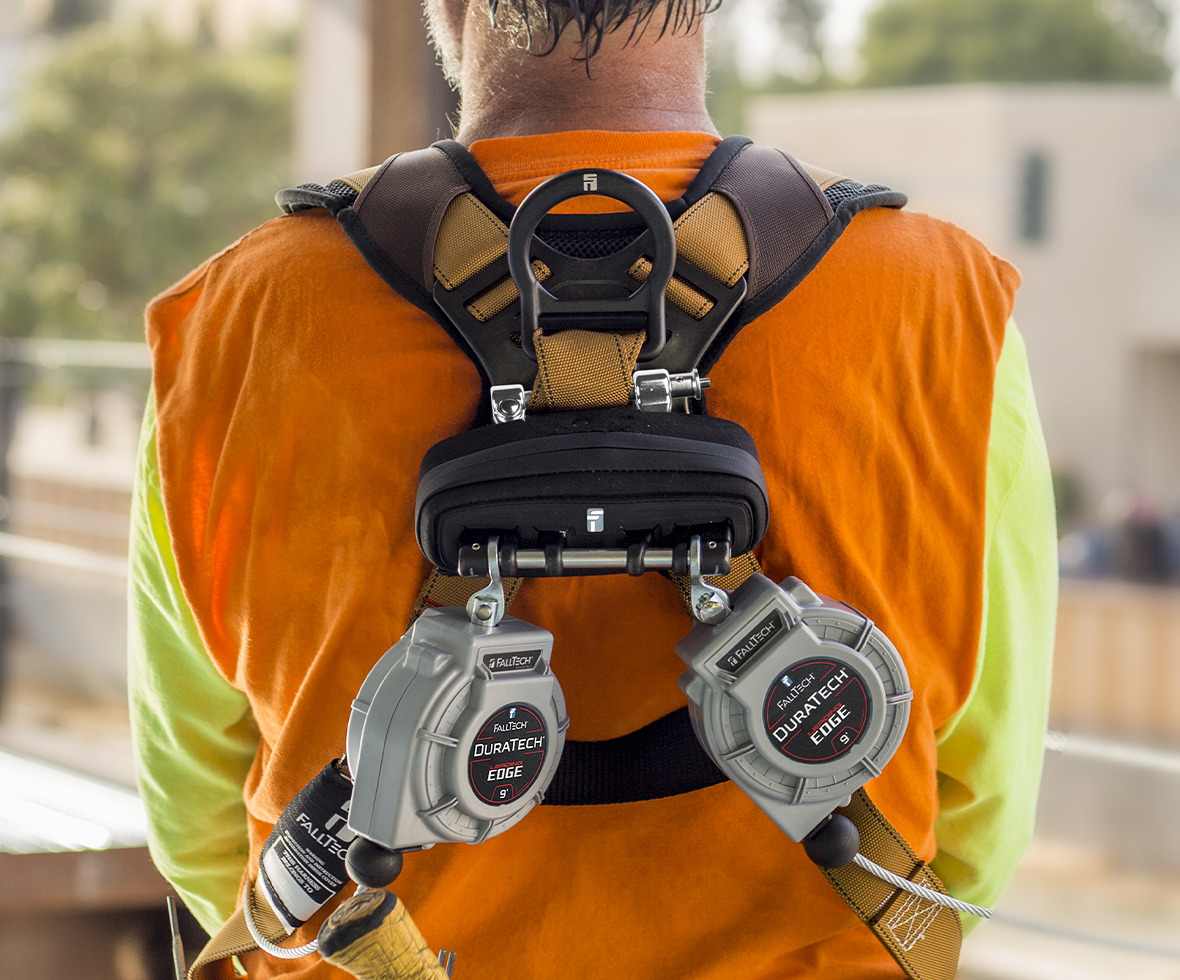 Construction worker wearing a DuraTech Personal Leading Edge twin-leg self-retracting lifeline