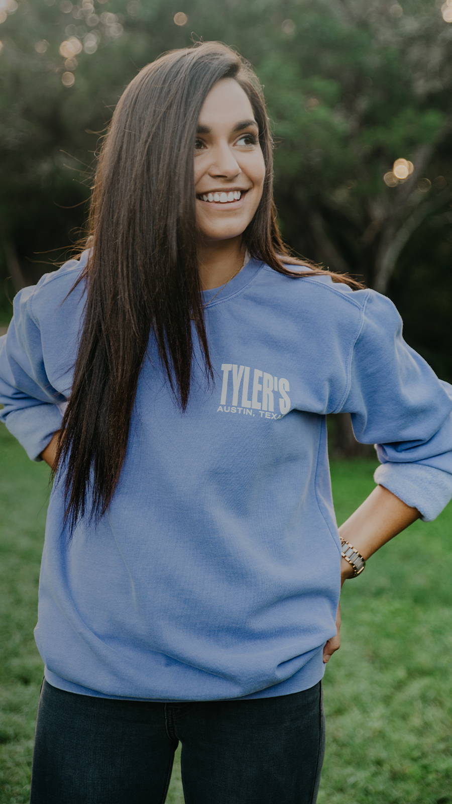 Young Woman wearing a TYLER'S sweatshirt in the park