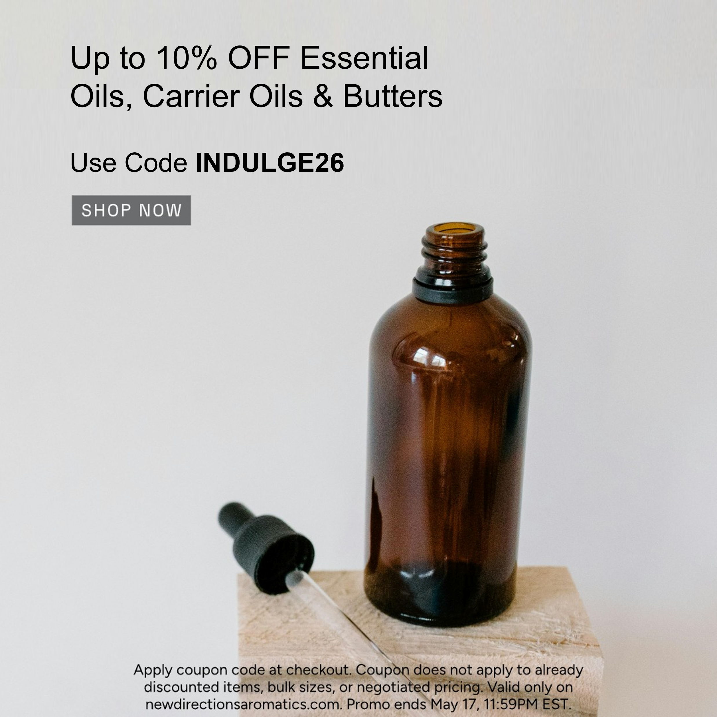 Brown glass bottle with dropper, promotional text for essential oils discount.