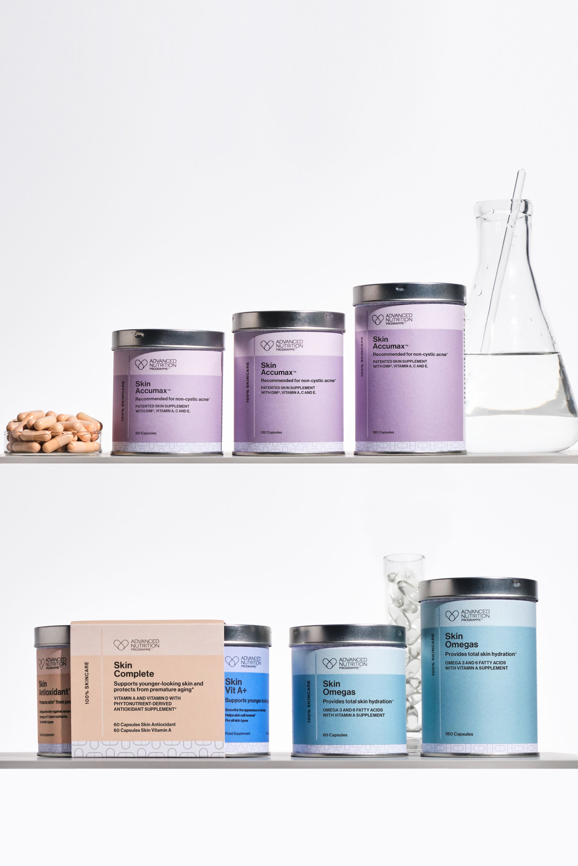 Assorted jars and a beaker on a shelf with supplements.