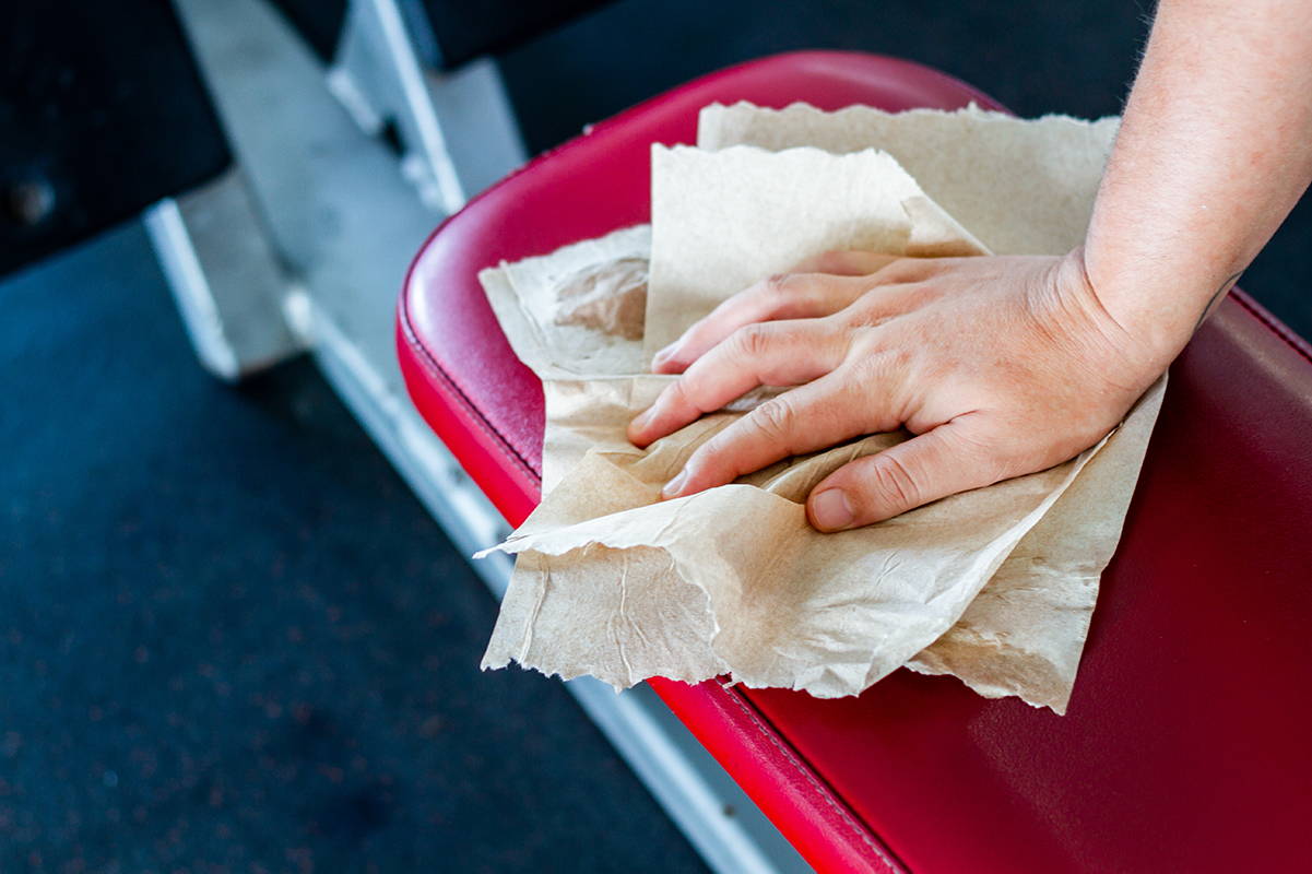 Cleaning a gym bench