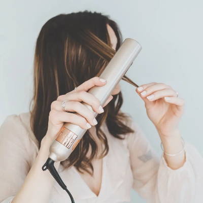 balyage brown highlighted hair using TYME iron pro 