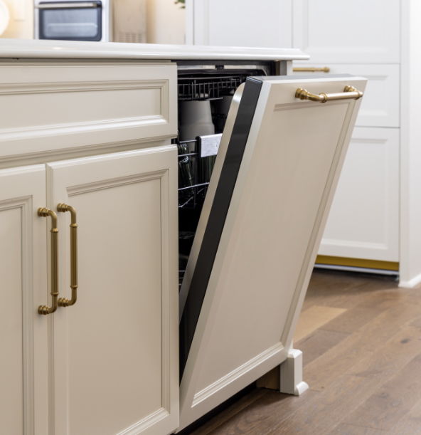 Open dishwasher in a modern kitchen with light-colored cabinetry.