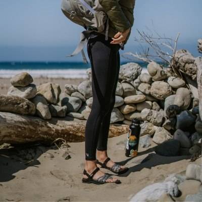 Woman on the beach wearing Samara walking sandals