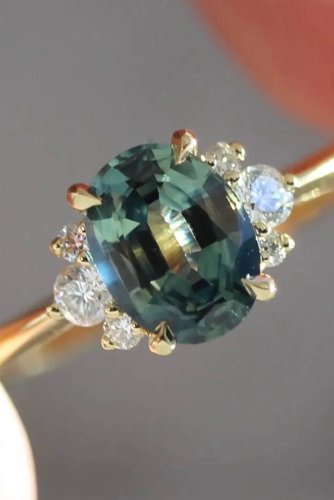 Oval sapphire and diamond half halo mirella ring