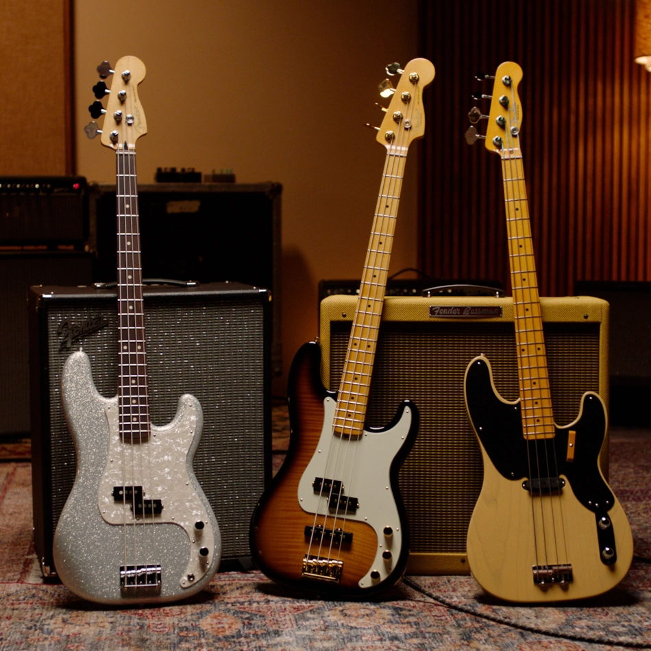Three Fender Precision Bass guitars in a studio setting