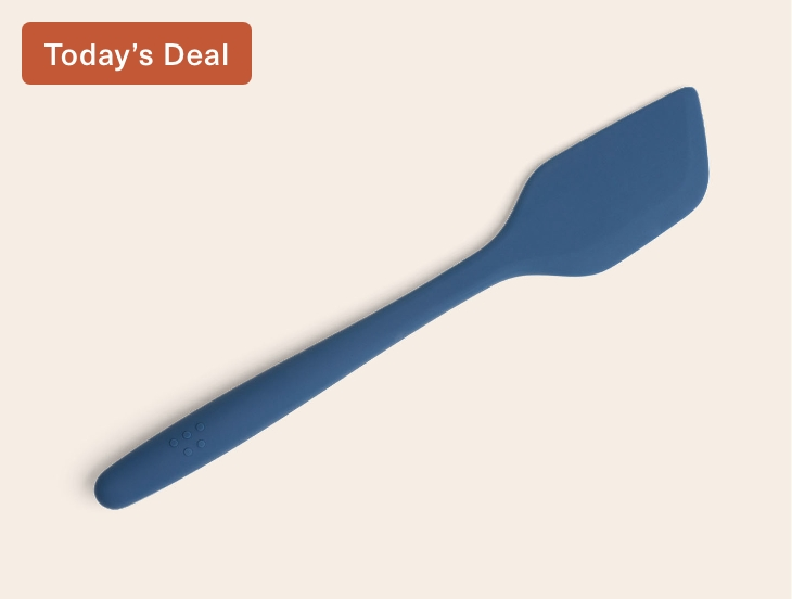 A blue Misen Silicone Spatula seen from above, with raised Misen logo visible on its ergonomic handle.