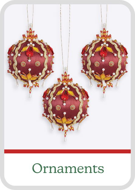 Three decorative red satin & bead ornaments hanging with a label reading 