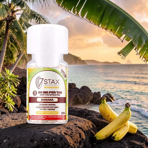 Bottle of banana flavoring with tropical background and bananas.