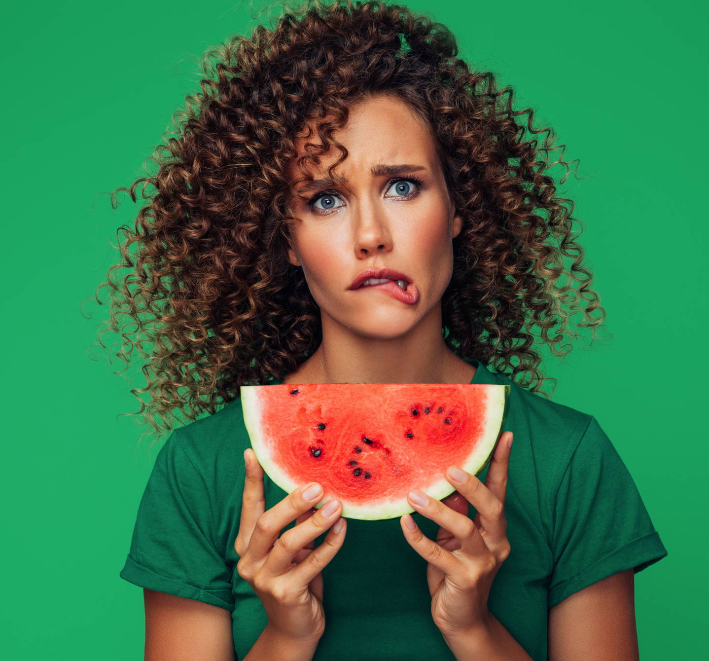 What is oral allergy syndrome? It could give this woman a tingly mouth if she has hay fever and eats her slice of watermelon