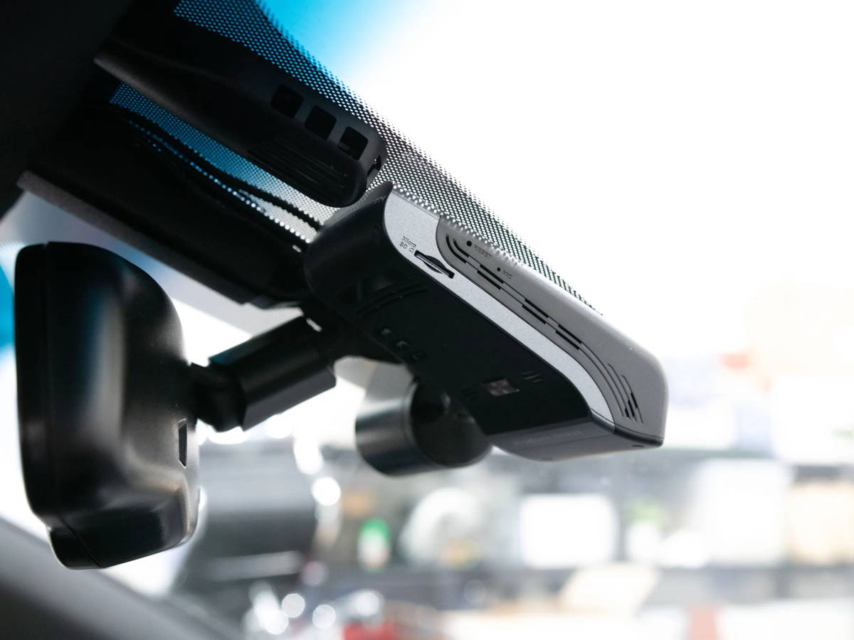 Low-profile dash cam mounted near the windshield