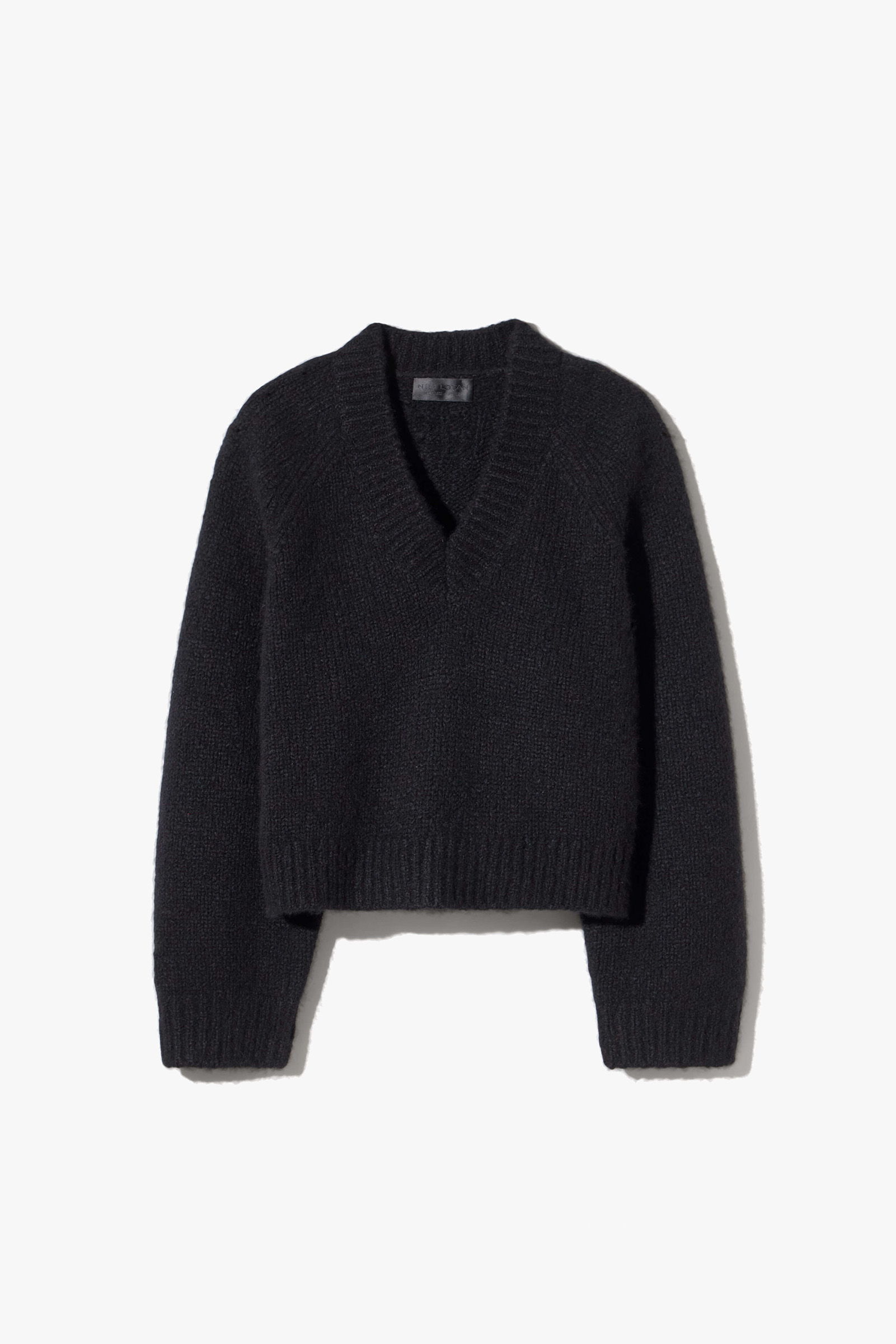 Black cropped sweater with a V-neck and long sleeves.