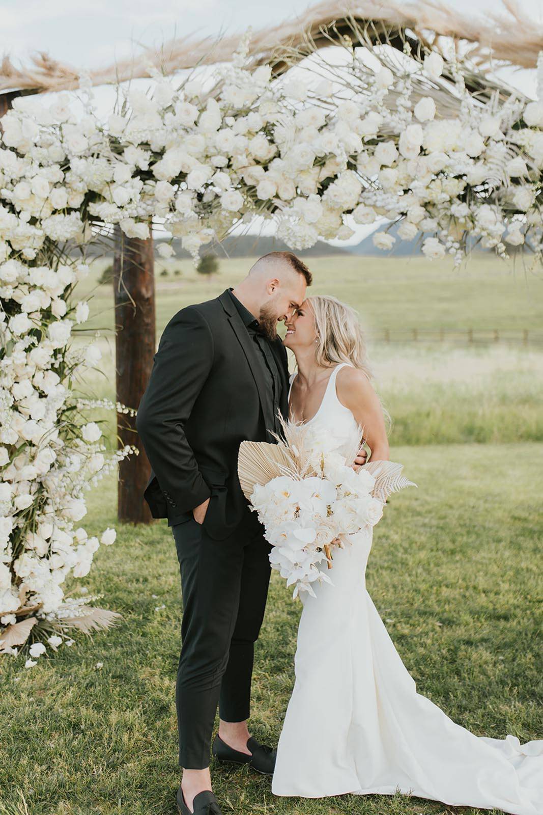 bride and groom, smiling at each other