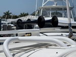 Dual black marine air horns mounted on white boat tower with brass air line fittings photo 2