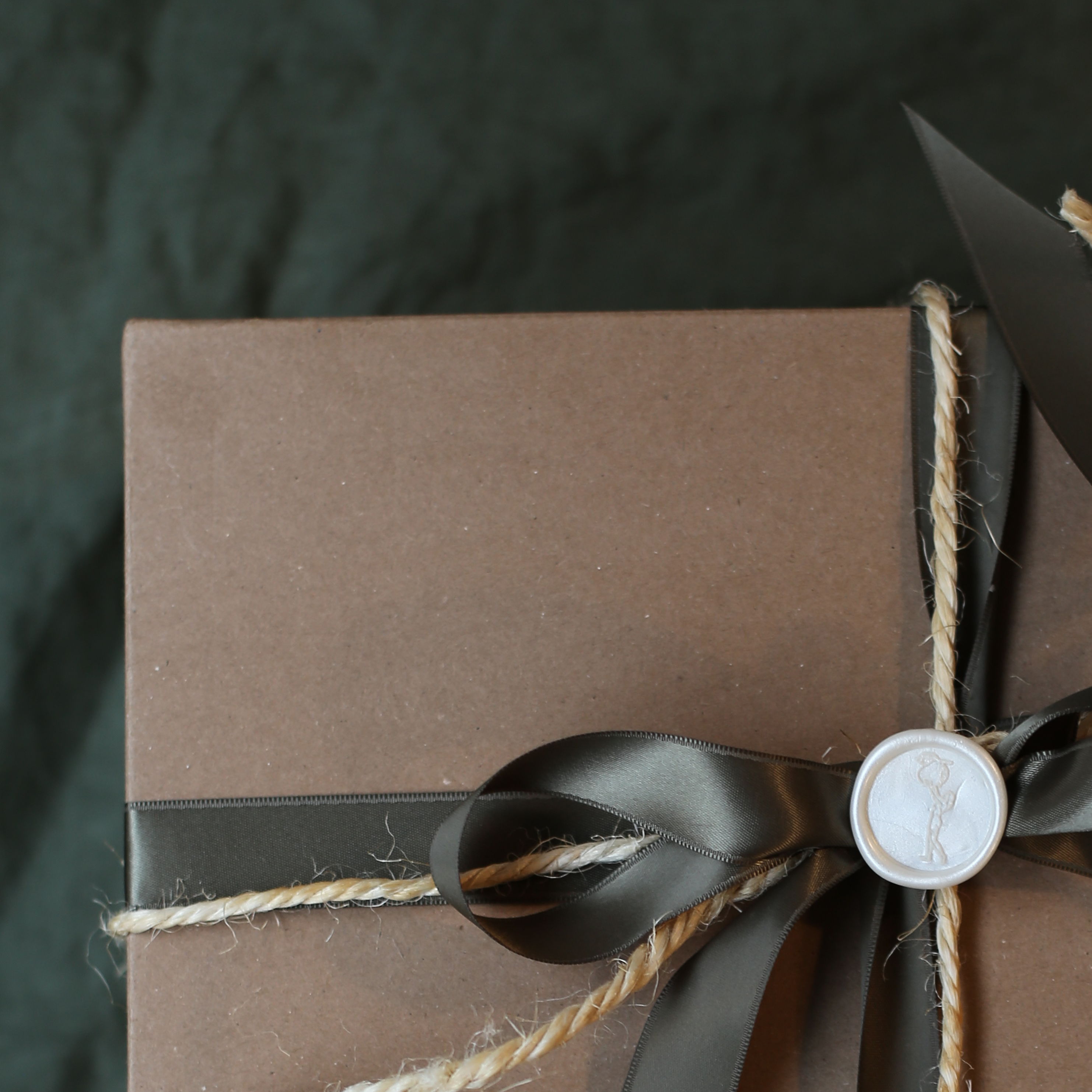 Girl Meets Dirt preserve gift box with ribbon and wax seal