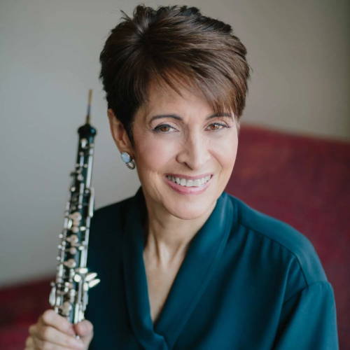 Oboist Elaine Douvas holding an oboe