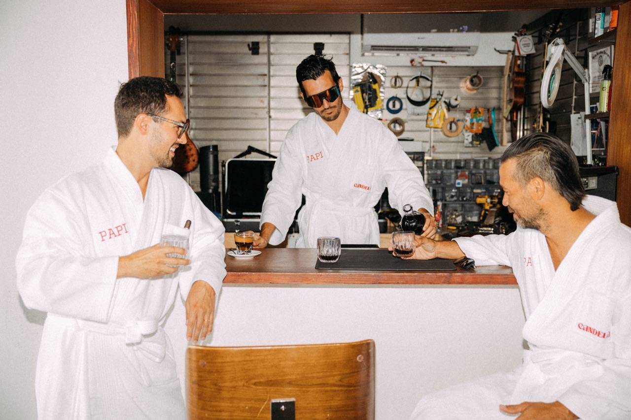 Candela Mamajuana Father's Day Robes, men drinking mamajuana in vintage car garage