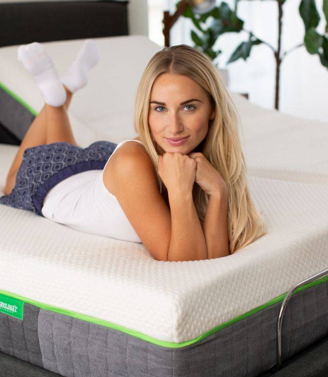 Woman lying on a classic mattress