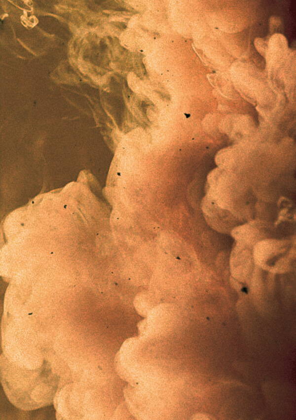 A close up mood image of smoke with wood chips.